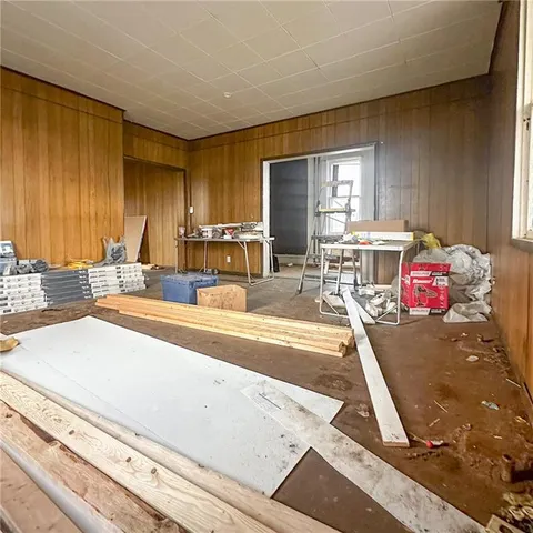 a view of a porch with a table and chairs
