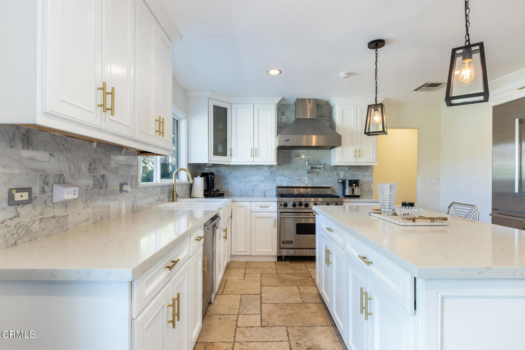 3623 St Elizabeth Road Glendale, CA 91206 - Photo 18 of 52 a kitchen with stainless steel appliances granite countertop a sink stove and refrigerator