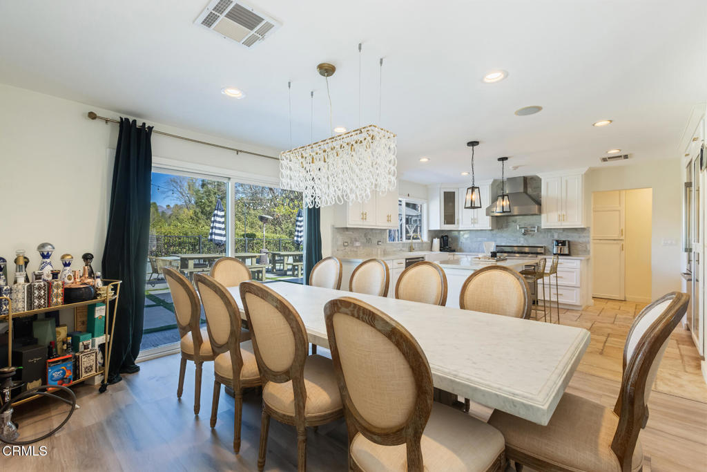 3623 St Elizabeth Road Glendale, CA 91206 - Photo 28 of 52 a view of a dining room with furniture a chandelier and wooden floor