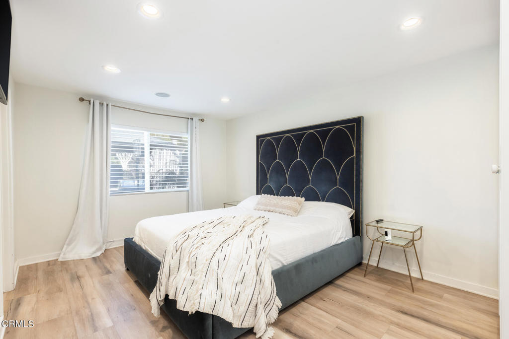 3623 St Elizabeth Road Glendale, CA 91206 - Photo 30 of 52 a spacious bedroom with a bed and a window