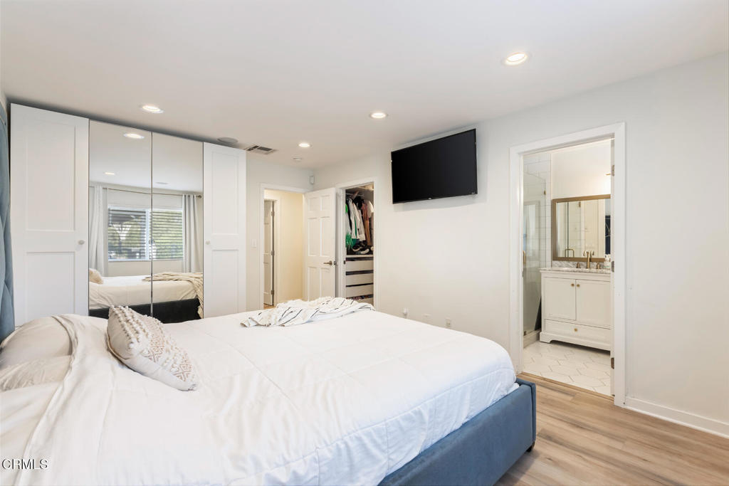 3623 St Elizabeth Road Glendale, CA 91206 - Photo 32 of 52 a bedroom with a large bed and a flat screen tv