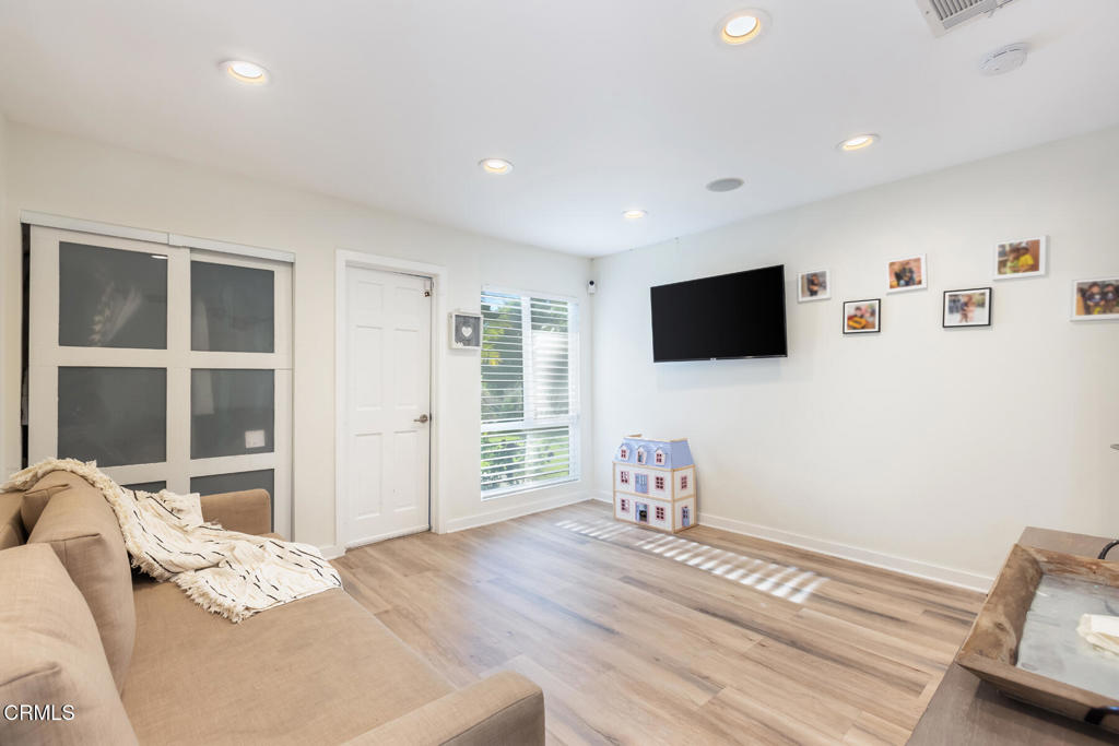 3623 St Elizabeth Road Glendale, CA 91206 - Photo 39 of 52 a bedroom with furniture and a flat screen tv