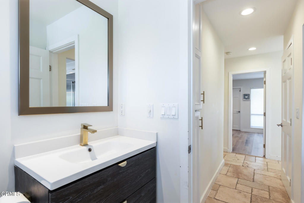 3623 St Elizabeth Road Glendale, CA 91206 - Photo 42 of 52 a bathroom with a sink a mirror and a shower