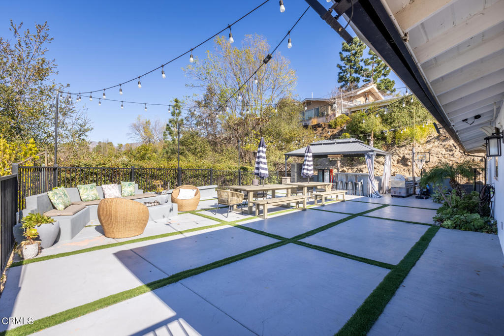 3623 St Elizabeth Road Glendale, CA 91206 - Photo 43 of 52 a view of a patio with couches and table and chairs and potted plants
