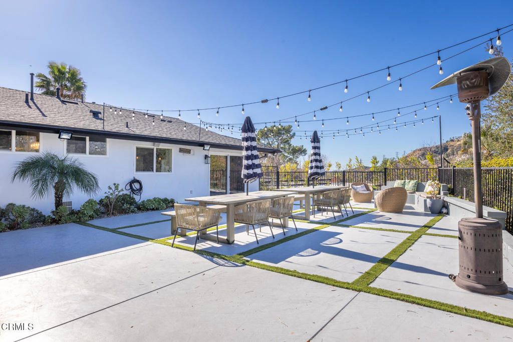 3623 St Elizabeth Road Glendale, CA 91206 - Photo 45 of 52 a view of a patio with a table and chairs potted plants