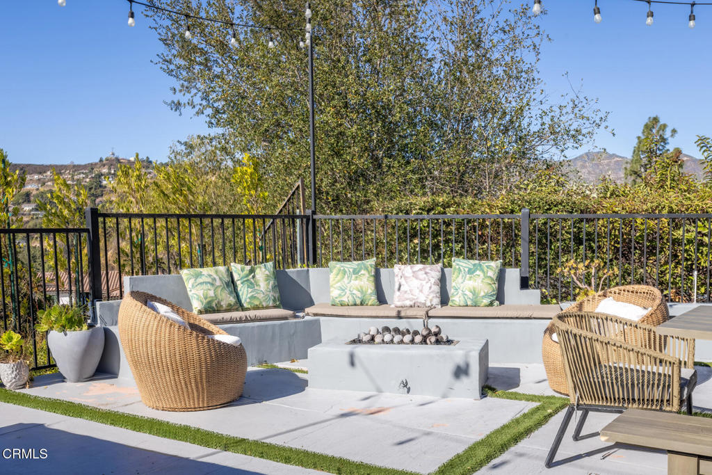 3623 St Elizabeth Road Glendale, CA 91206 - Photo 47 of 52 a view of a deck with couches table and chairs and potted plants