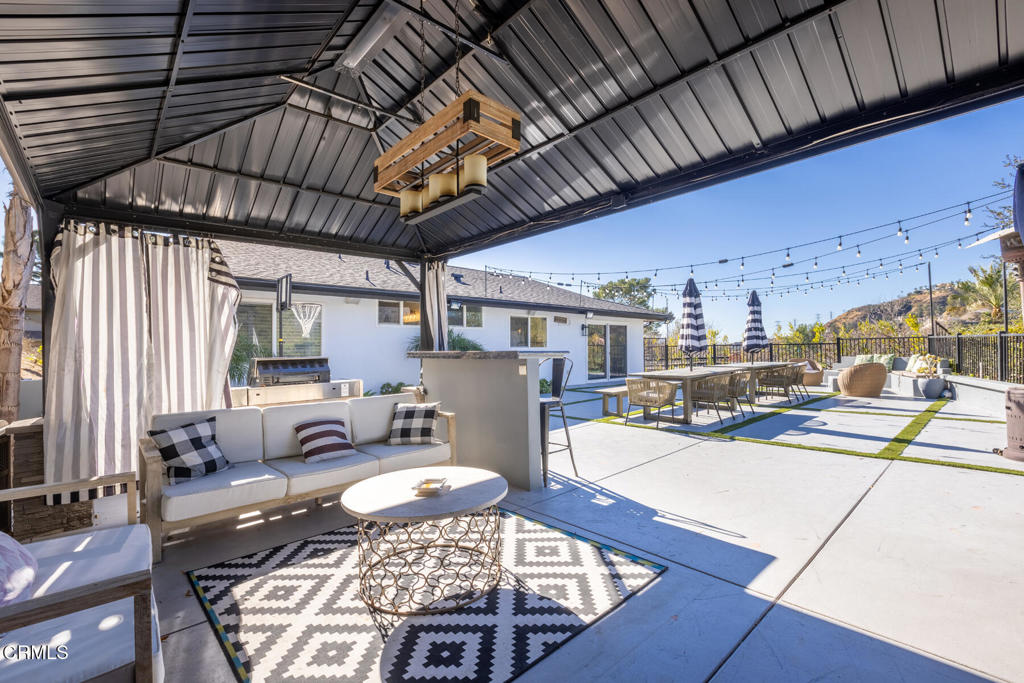 3623 St Elizabeth Road Glendale, CA 91206 - Photo 51 of 52 a living room with lots of furniture and wood flooring