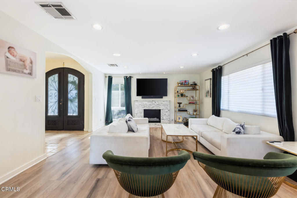 3623 St Elizabeth Road Glendale, CA 91206 - Photo 10 of 52 a living room with fireplace furniture and a flat screen tv