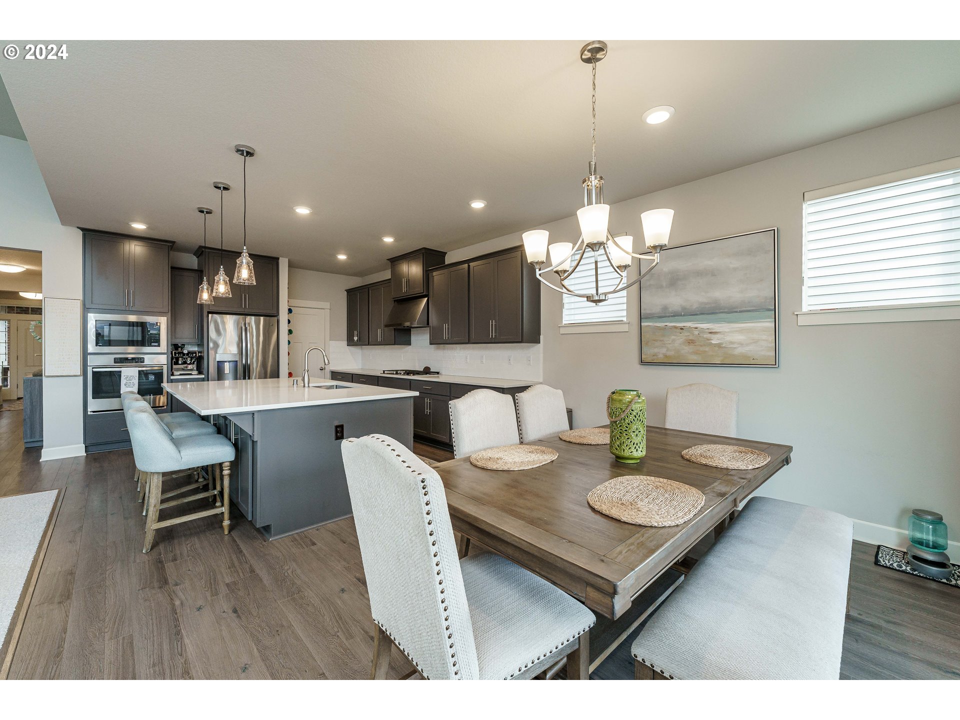 1839 South 47th Place Ridgefield, WA 98642 - Photo 25 of 40 a kitchen with a dining table chairs and view kitchen