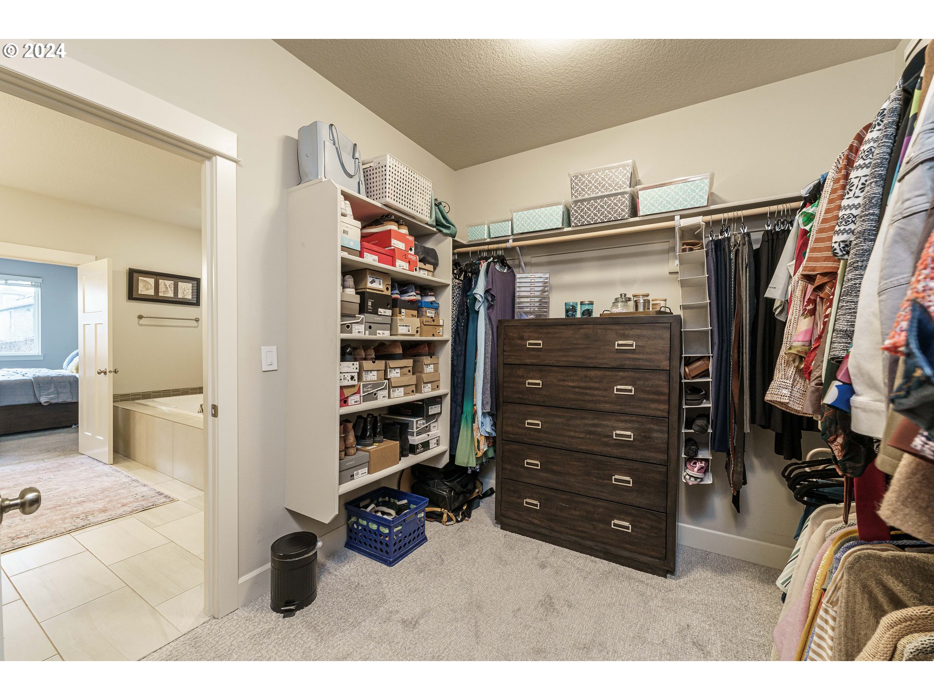 1839 South 47th Place Ridgefield, WA 98642 - Photo 31 of 40 a view of walk in closet with clothes and shoes