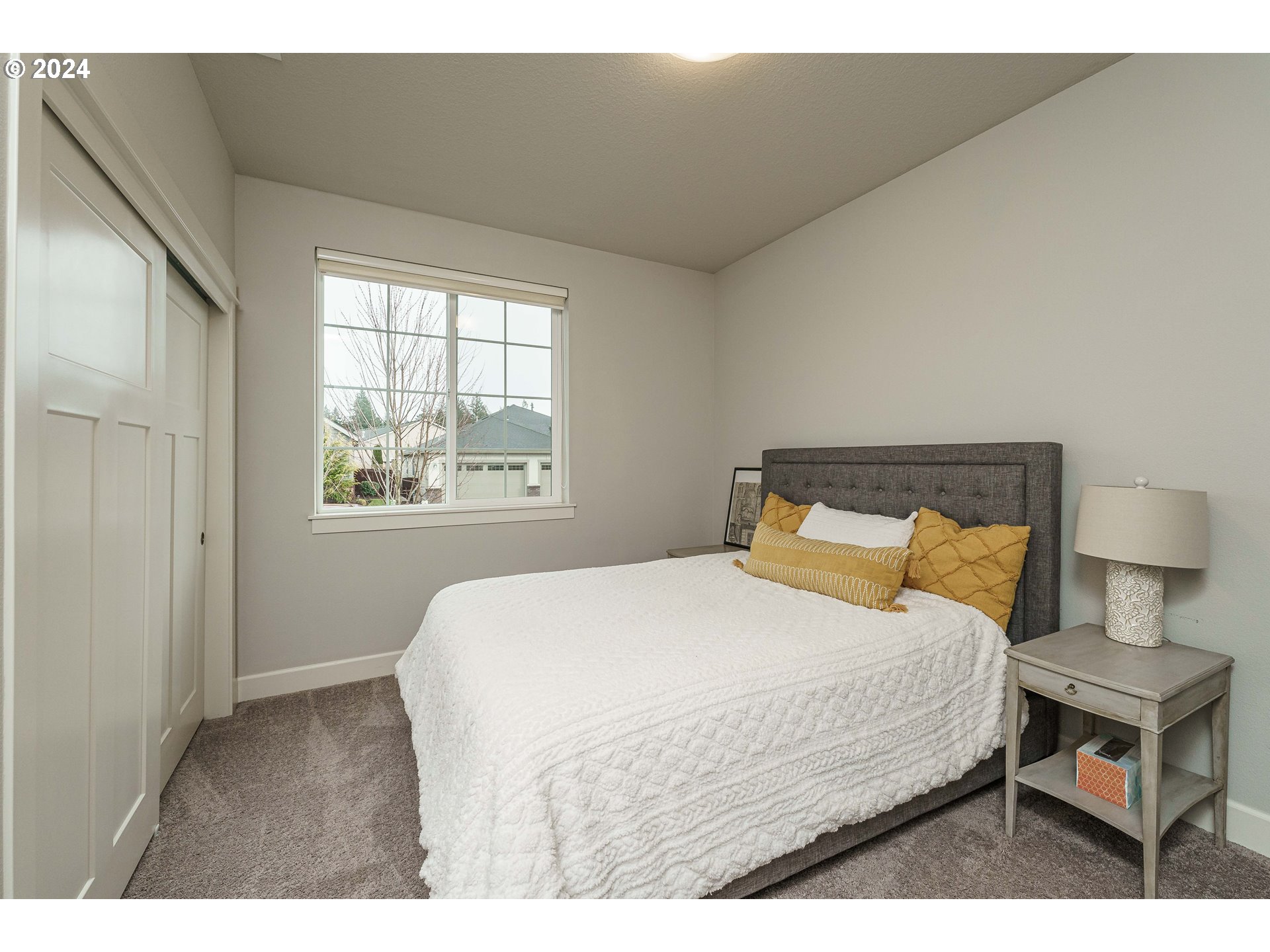1839 South 47th Place Ridgefield, WA 98642 - Photo 7 of 40 a bedroom with a bed and a night stand