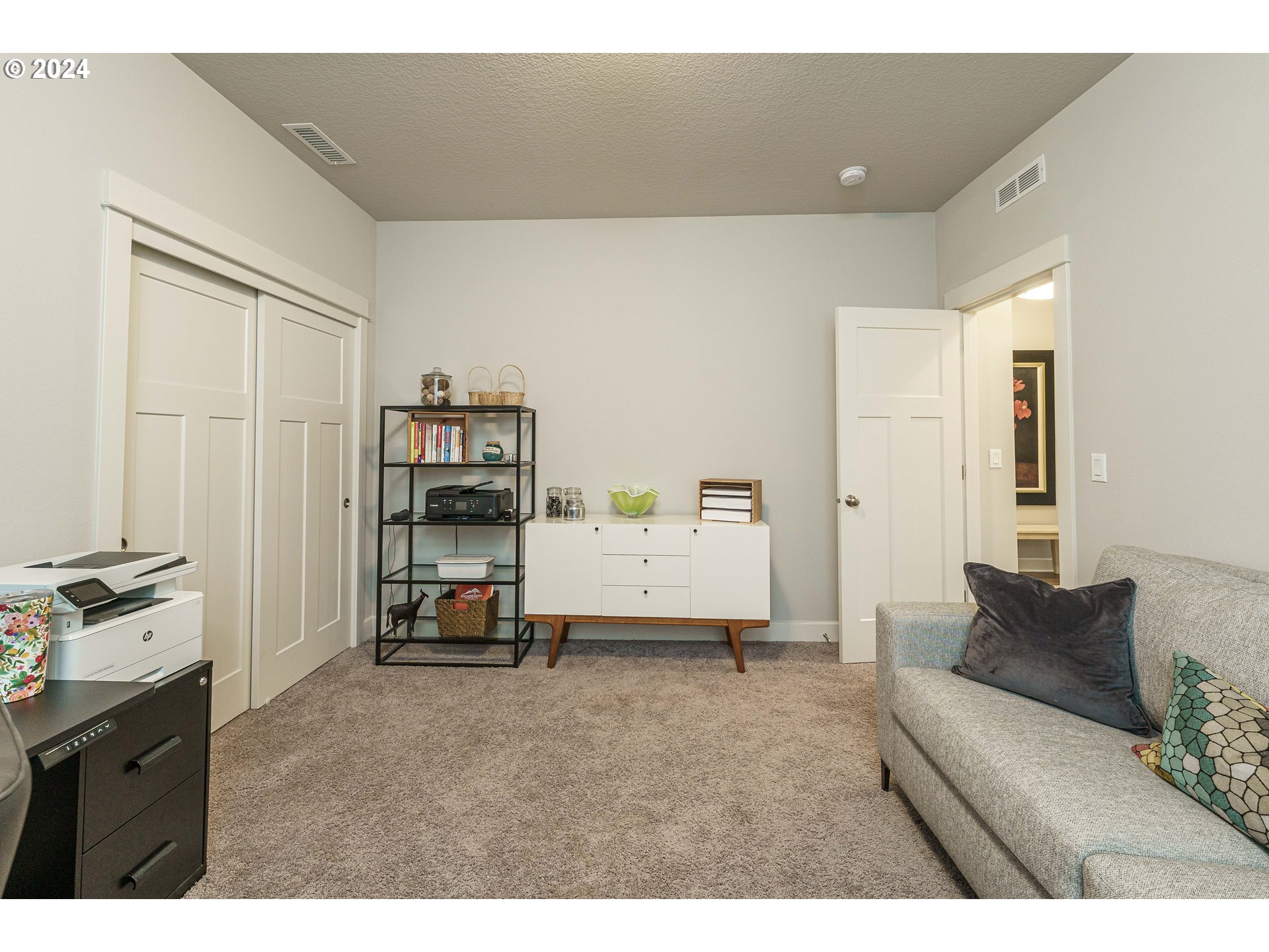 1839 South 47th Place Ridgefield, WA 98642 - Photo 8 of 40 a living room with a couch and dresser