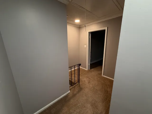 a view of a room with wooden walls