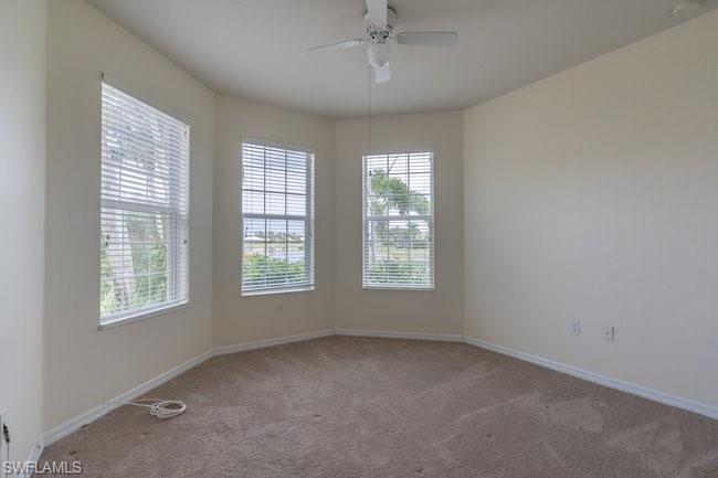 8887 Ravello Court Naples, FL 34114 - Photo 19 of 22 Carpeted empty room featuring ceiling fan
