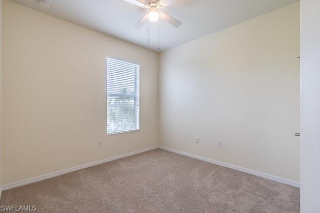 8887 Ravello Court Naples, FL 34114 - Photo 21 of 22 Carpeted empty room featuring ceiling fan