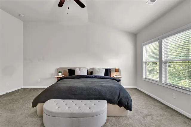 a bathroom with a granite countertop sink and a toilet