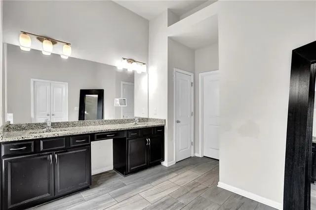 a view of a livingroom with wooden floor and a window