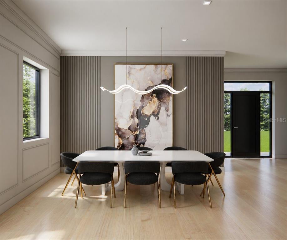 2501 Cole Road Orlando, FL 32803 - Photo 2 of 14 a view of a dining room with furniture and wooden floor