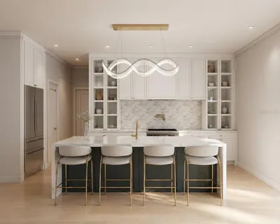 a kitchen with a dining table chairs and white cabinets