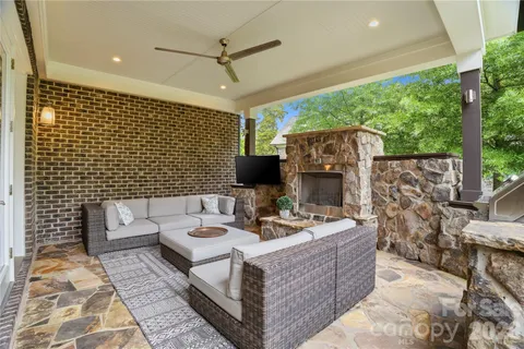 a view of a house with a yard and tree s