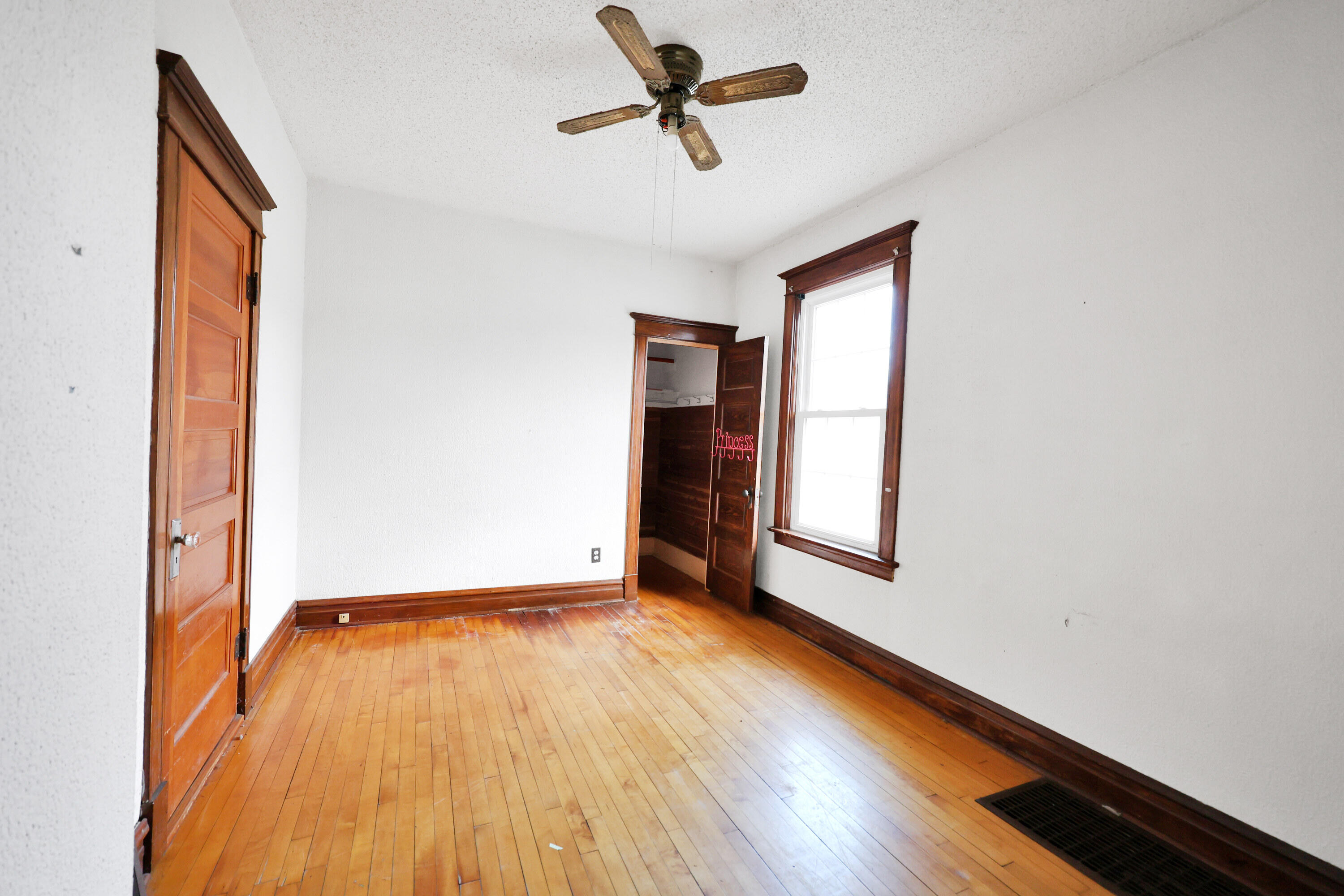 112 South Indiana Street Hobart, IN 46342 - Photo 14 of 25 a view of empty room with wooden floor and fan