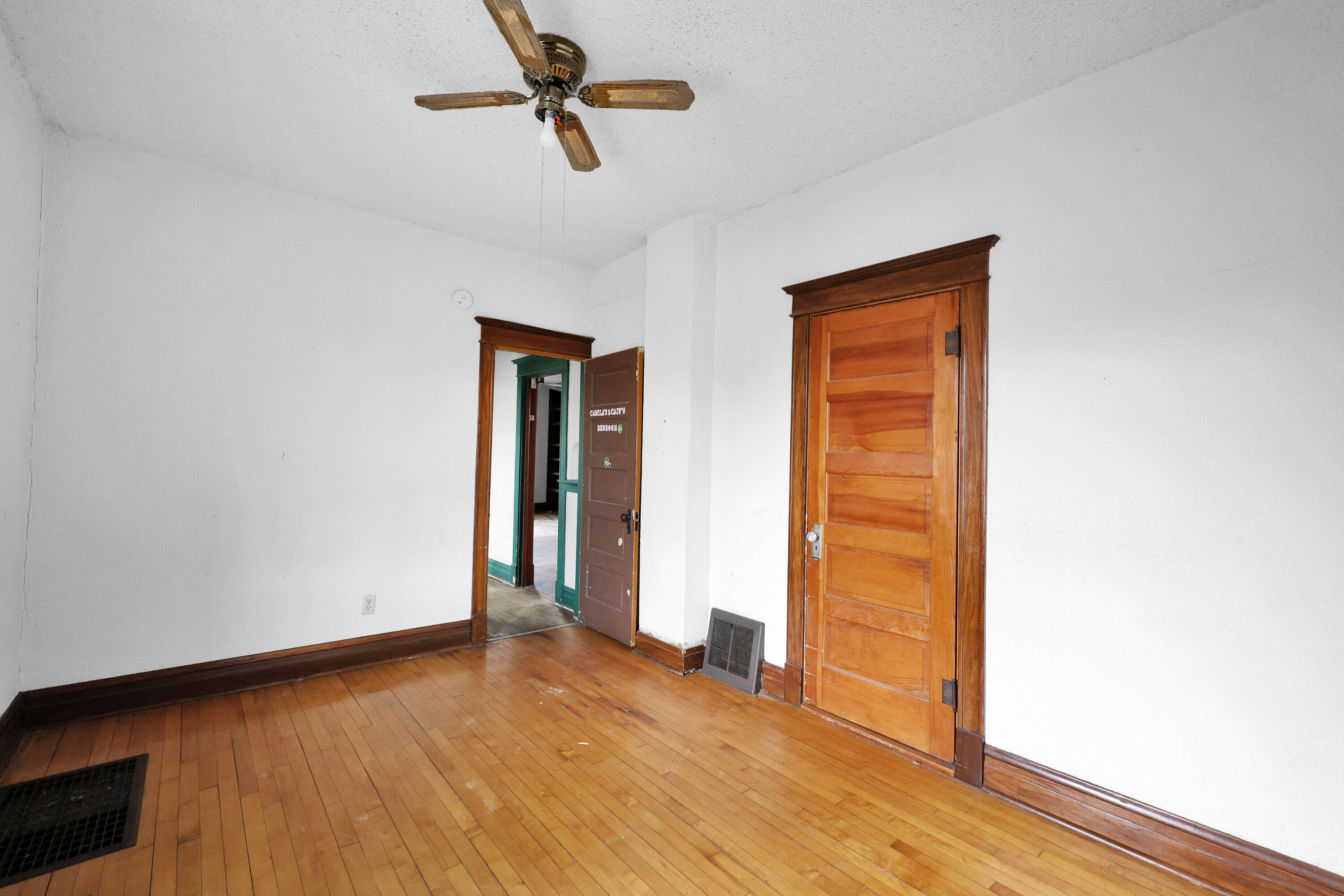 112 South Indiana Street Hobart, IN 46342 - Photo 15 of 25 a view of empty room with wooden floor and fan