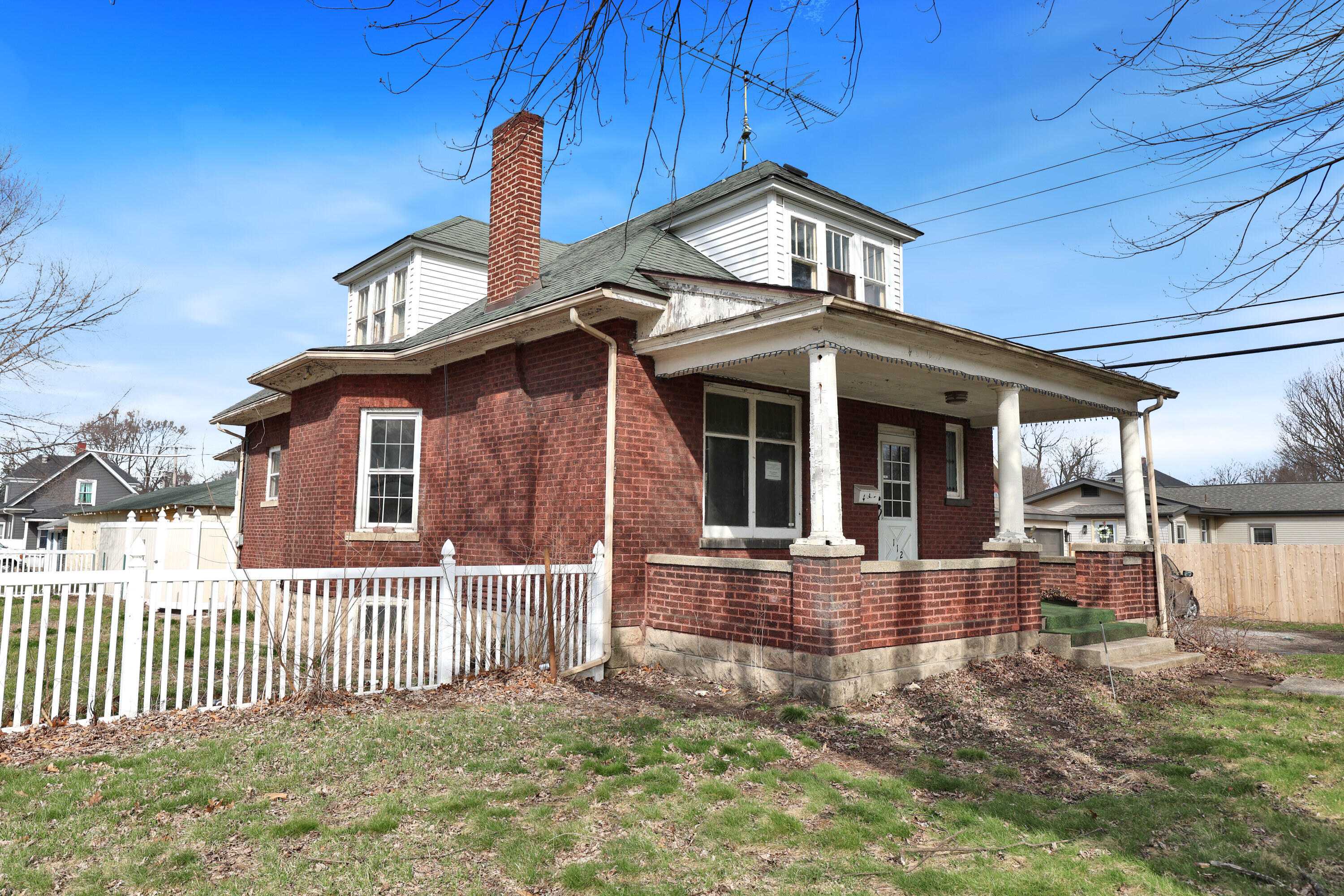 112 South Indiana Street Hobart, IN 46342 - Photo 3 of 25 a front view of a house with a yard