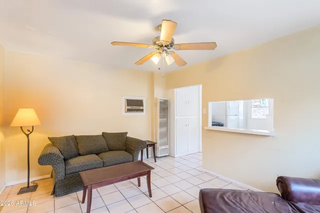 a living room with furniture and a window