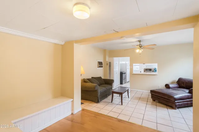 a living room with furniture and a window