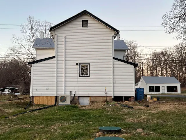 a view of a park with trees in the background