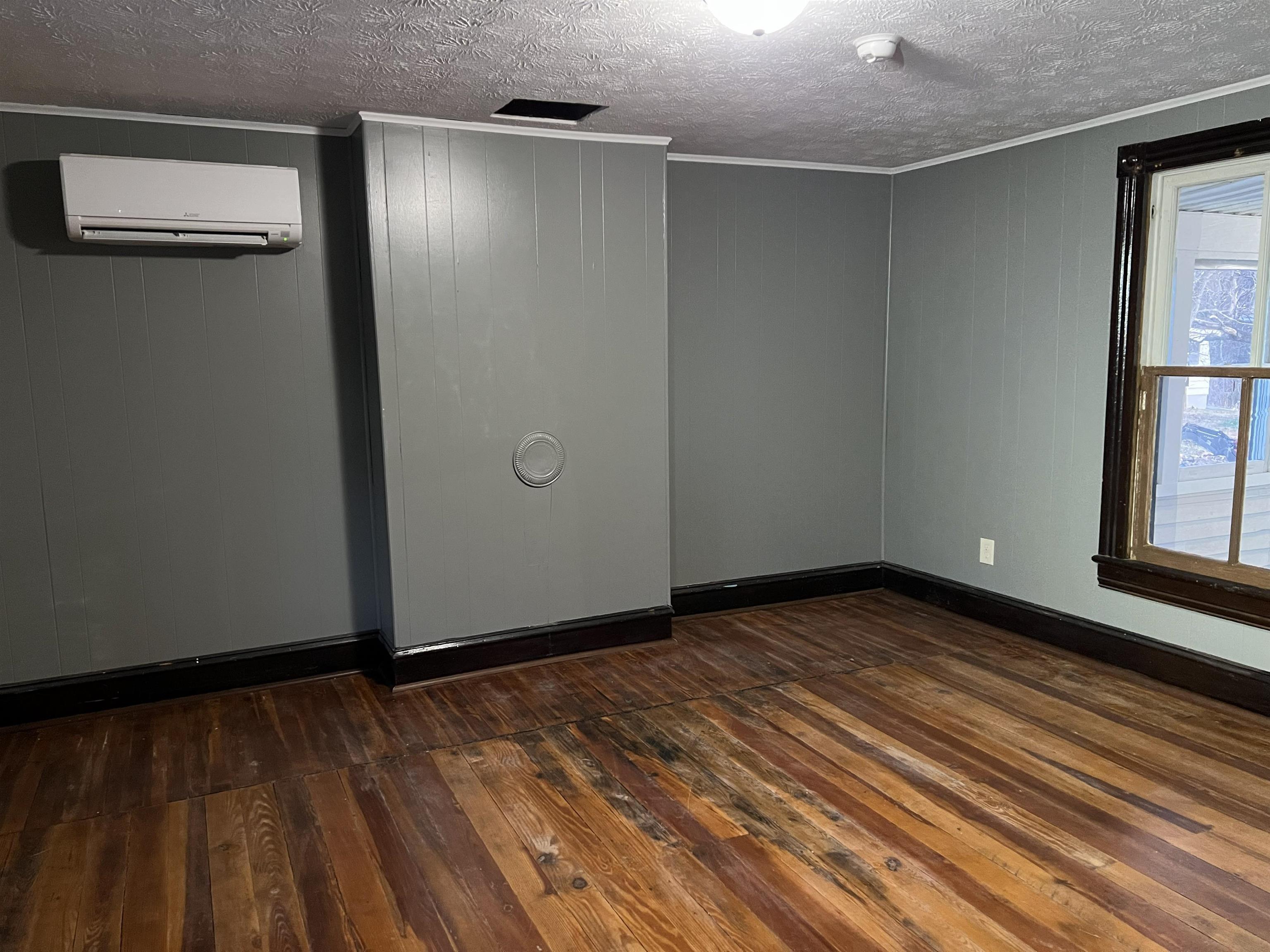 1795 New Hope And Crimora Road Crimora, VA 24431 - Photo 2 of 19 a view of an empty room with wooden floor and a window