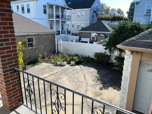 a patio with table and chairs