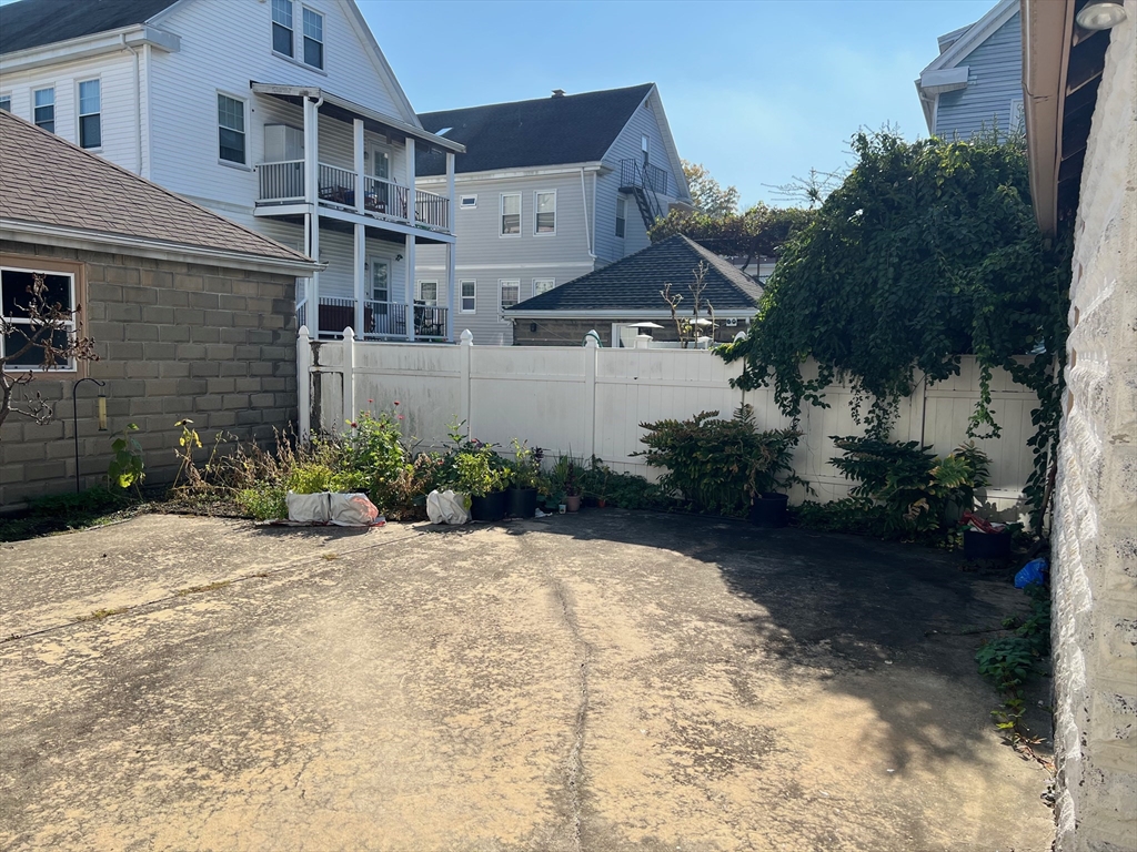 84 Melrose Street, Unit 1 Arlington, MA 02474 - Photo 5 of 42 a view of a house with a yard