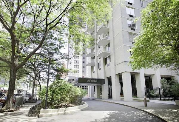a view of a building with a street