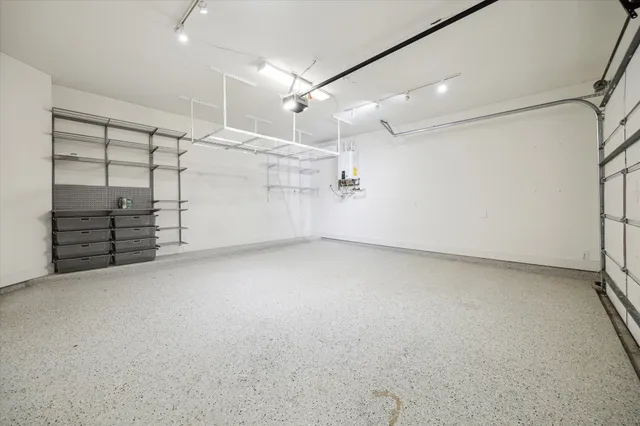 an empty room with storage and utility