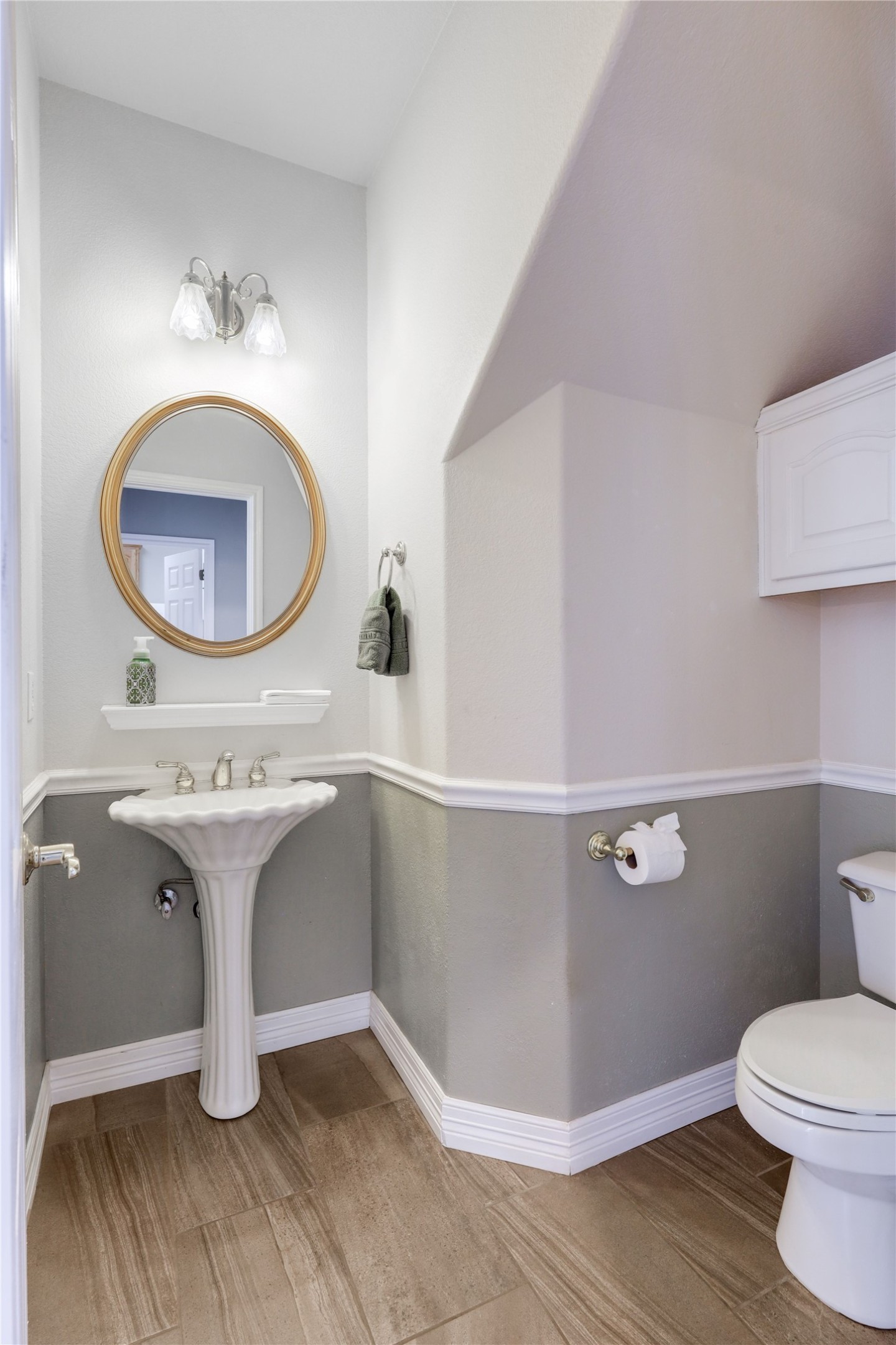 18607 White Rim Trail Jonestown, TX 78645 - Photo 18 of 40 Half bathroom featuring toilet and wood tiled floors