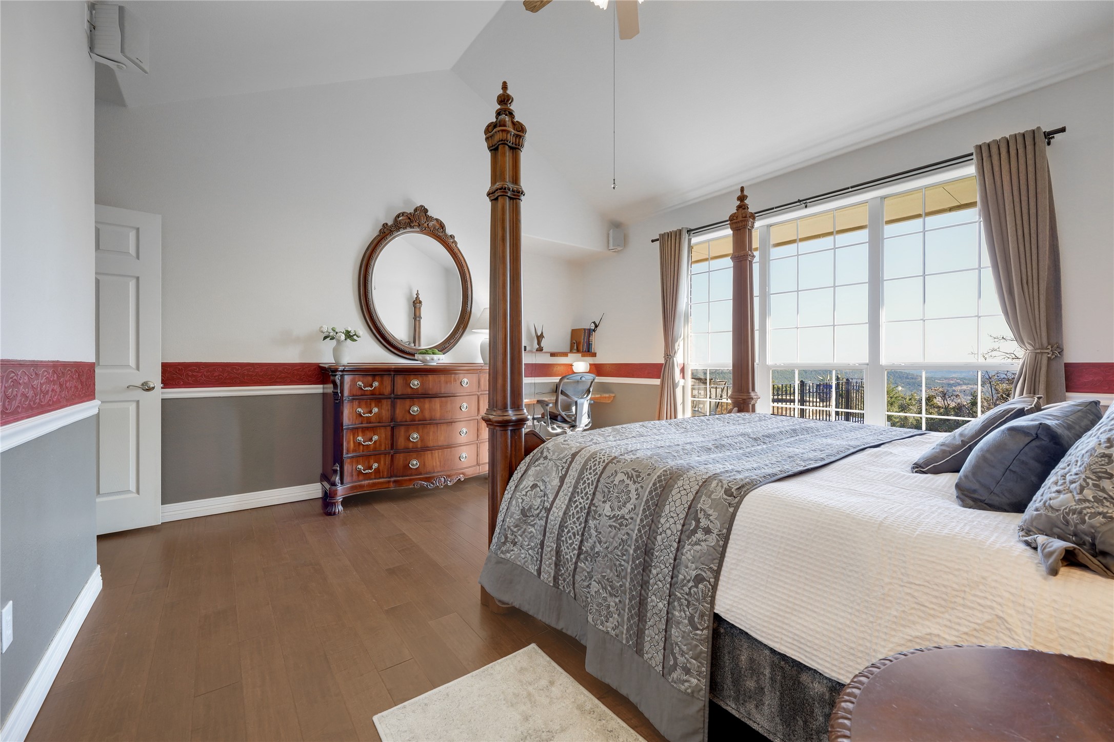 18607 White Rim Trail Jonestown, TX 78645 - Photo 19 of 40 Bedroom with dark wood-style floors, lofted ceiling, and a ceiling fan