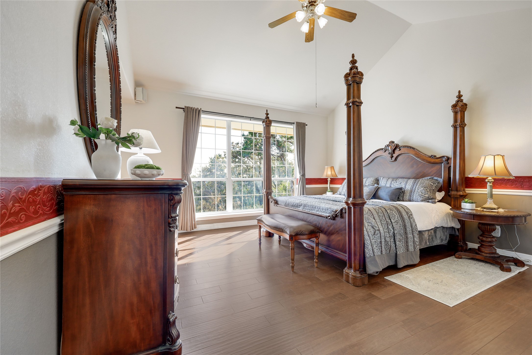 18607 White Rim Trail Jonestown, TX 78645 - Photo 20 of 40 Bedroom with wood finished floors, a ceiling fan, and lofted ceiling