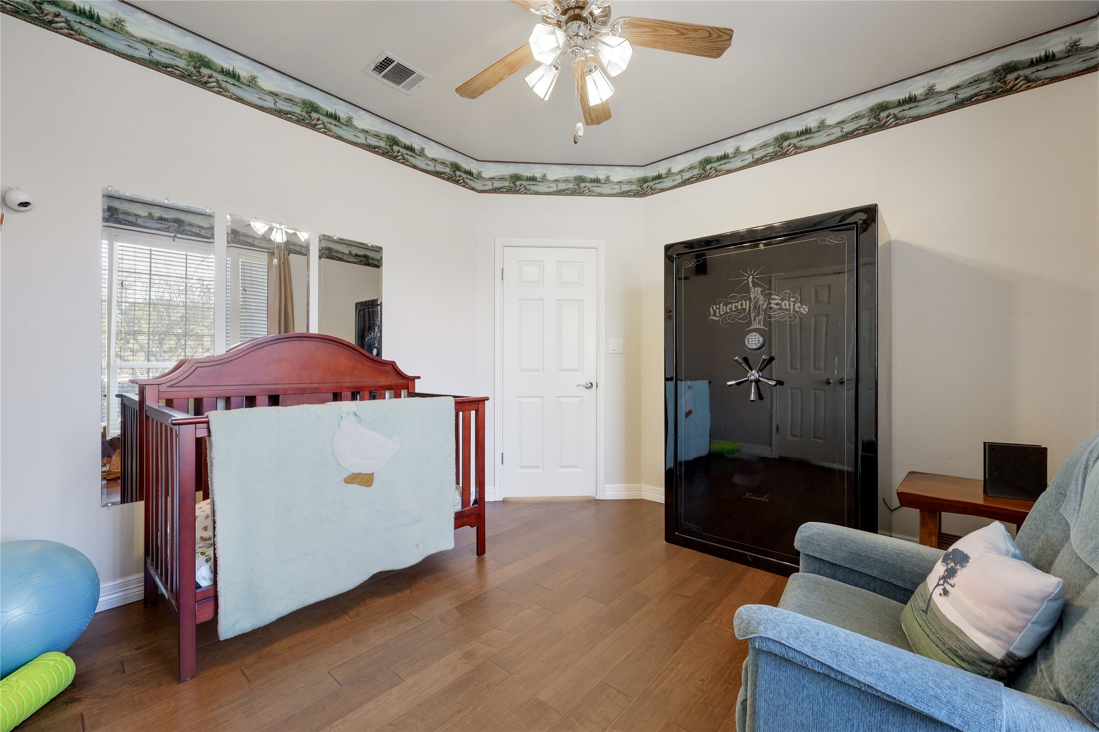 18607 White Rim Trail Jonestown, TX 78645 - Photo 24 of 40 Living area featuring wood finished floors and a ceiling fan