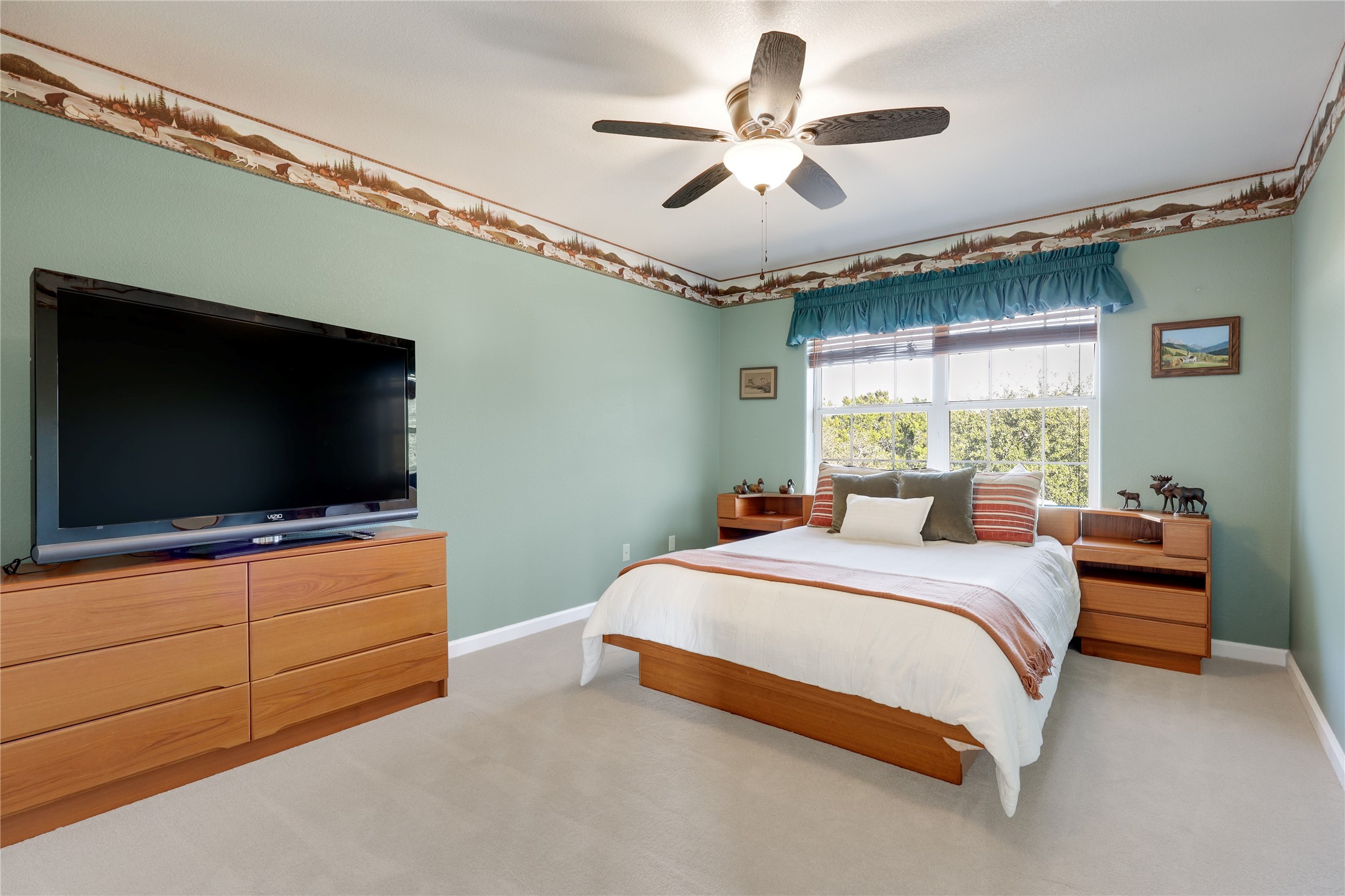 18607 White Rim Trail Jonestown, TX 78645 - Photo 28 of 40 Bedroom with light carpet and ceiling fan