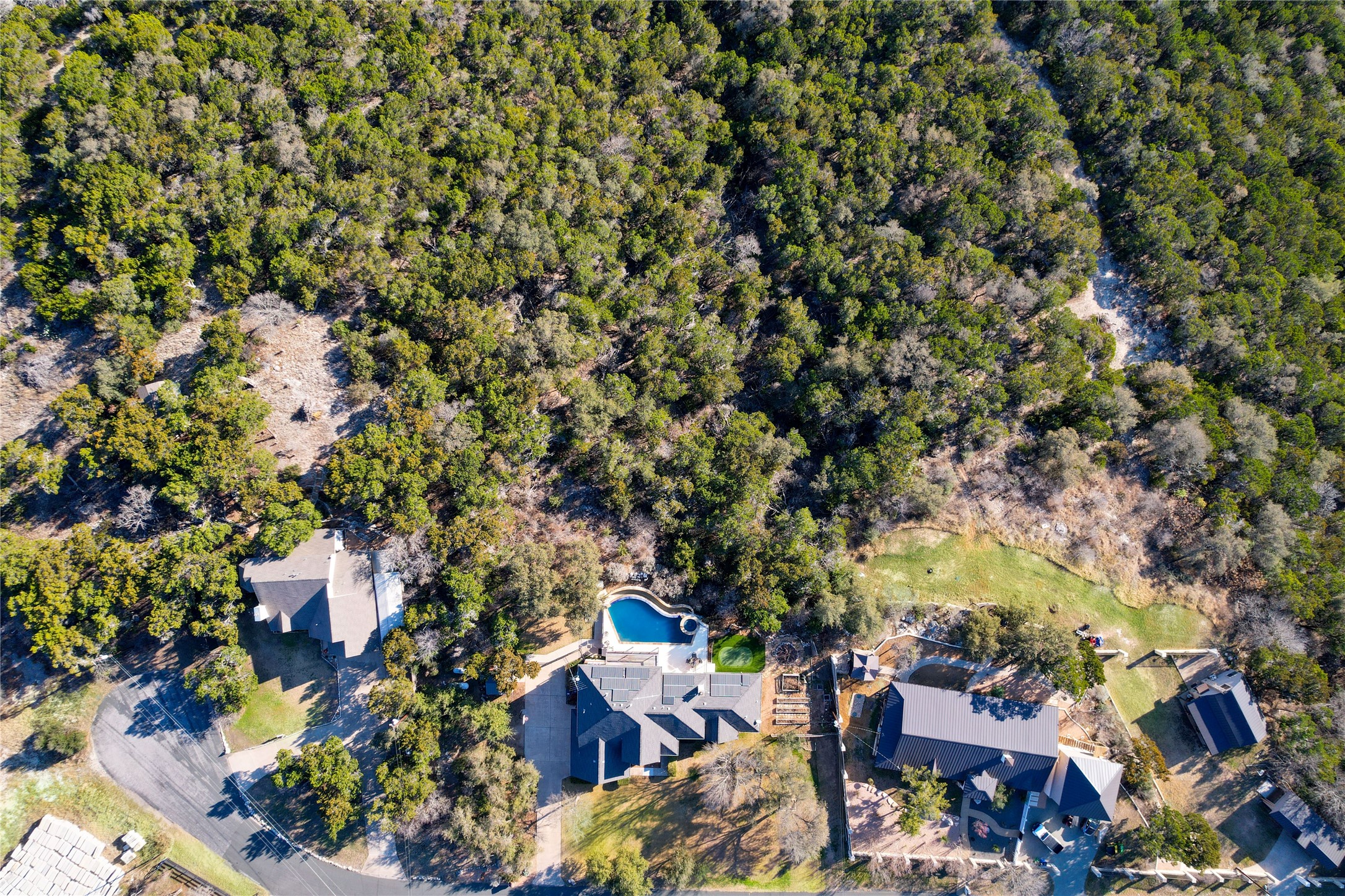 18607 White Rim Trail Jonestown, TX 78645 - Photo 37 of 40 Drone / aerial view of a heavily wooded area
