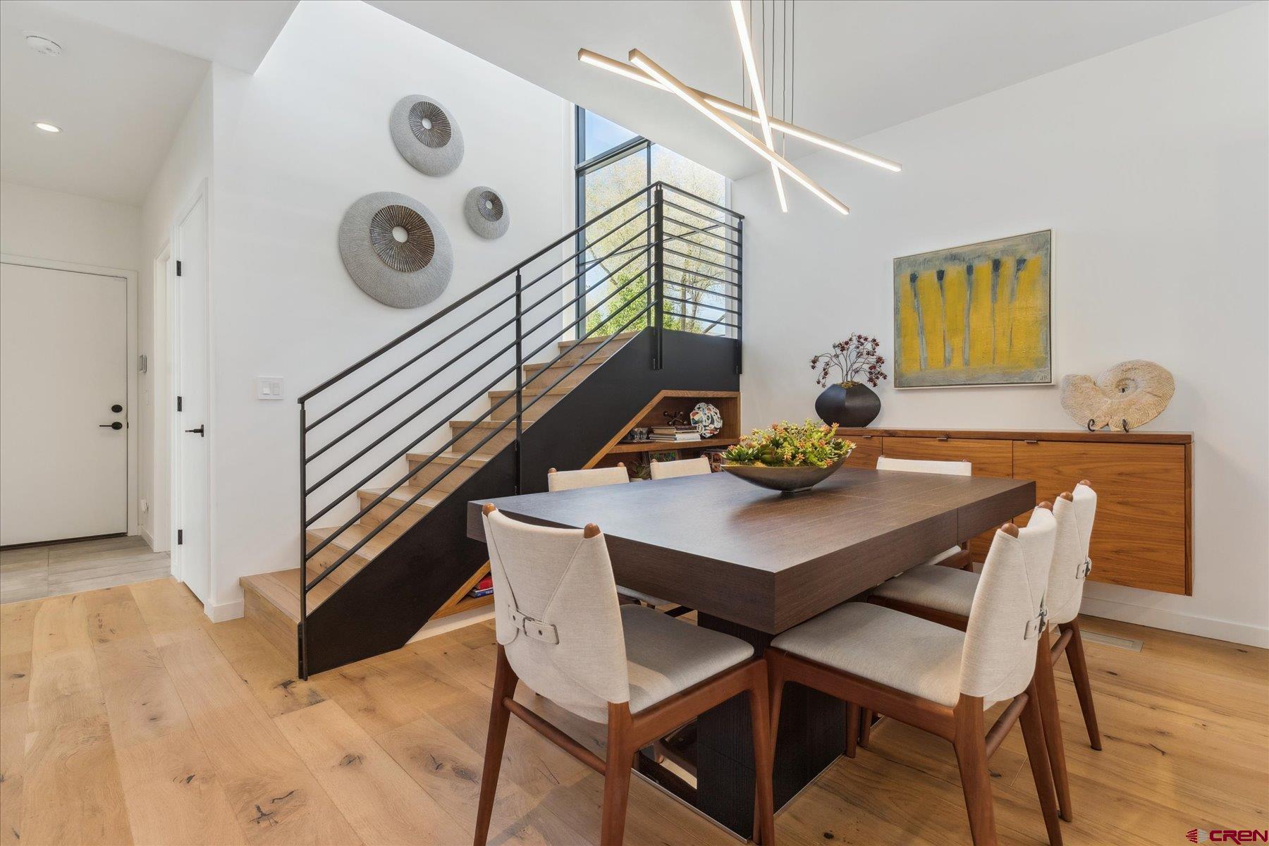 73 Jameson Drive Durango, CO 81301 - Photo 12 of 43 a view of a dining room with furniture and wooden floor