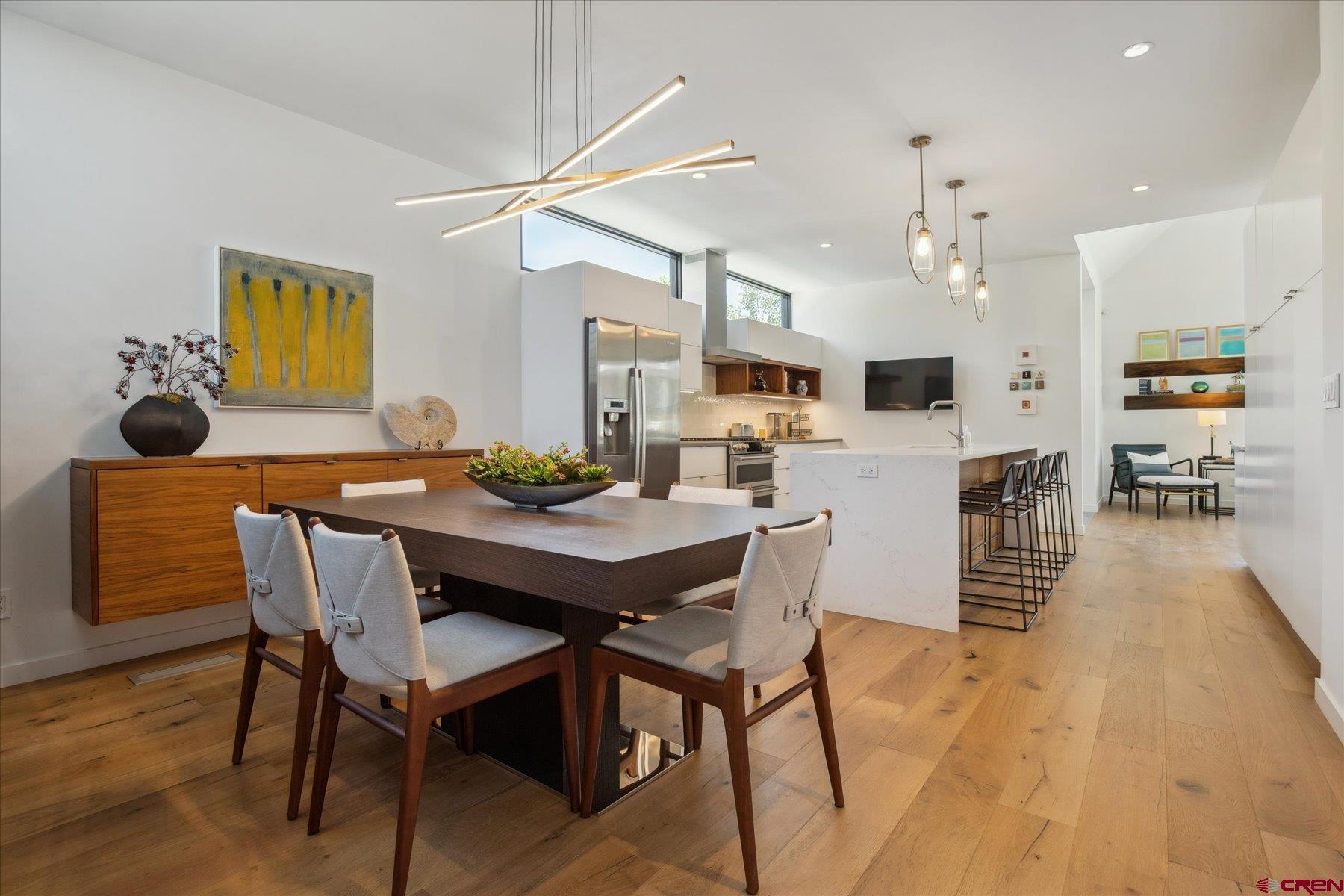 73 Jameson Drive Durango, CO 81301 - Photo 10 of 43 a view of a dining room with furniture and wooden floor