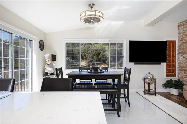 a living room with fireplace furniture and a flat screen tv