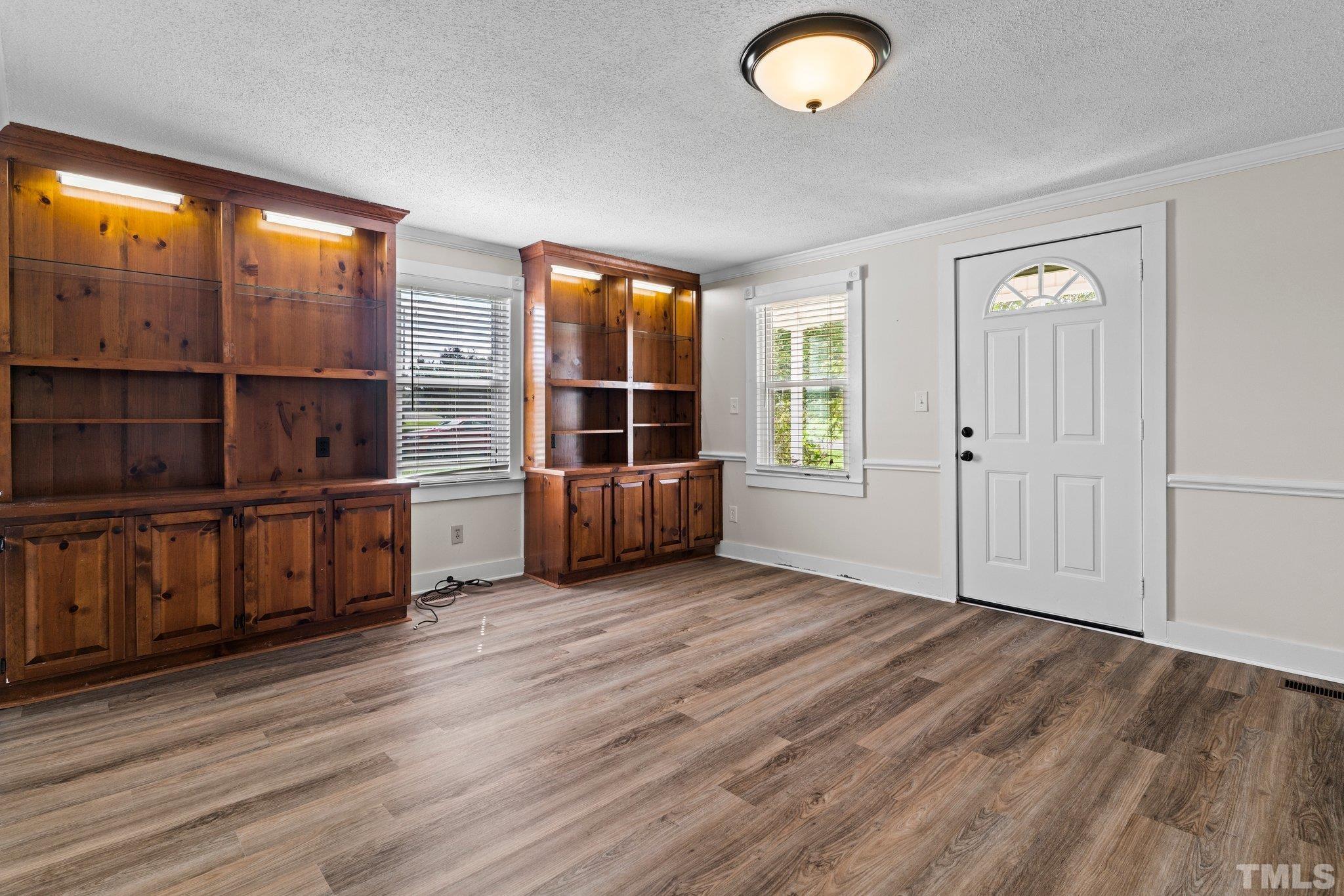 2929 Wall Store Road Garner, NC 27529 - Photo 12 of 59 wooden floor in an empty room with a window