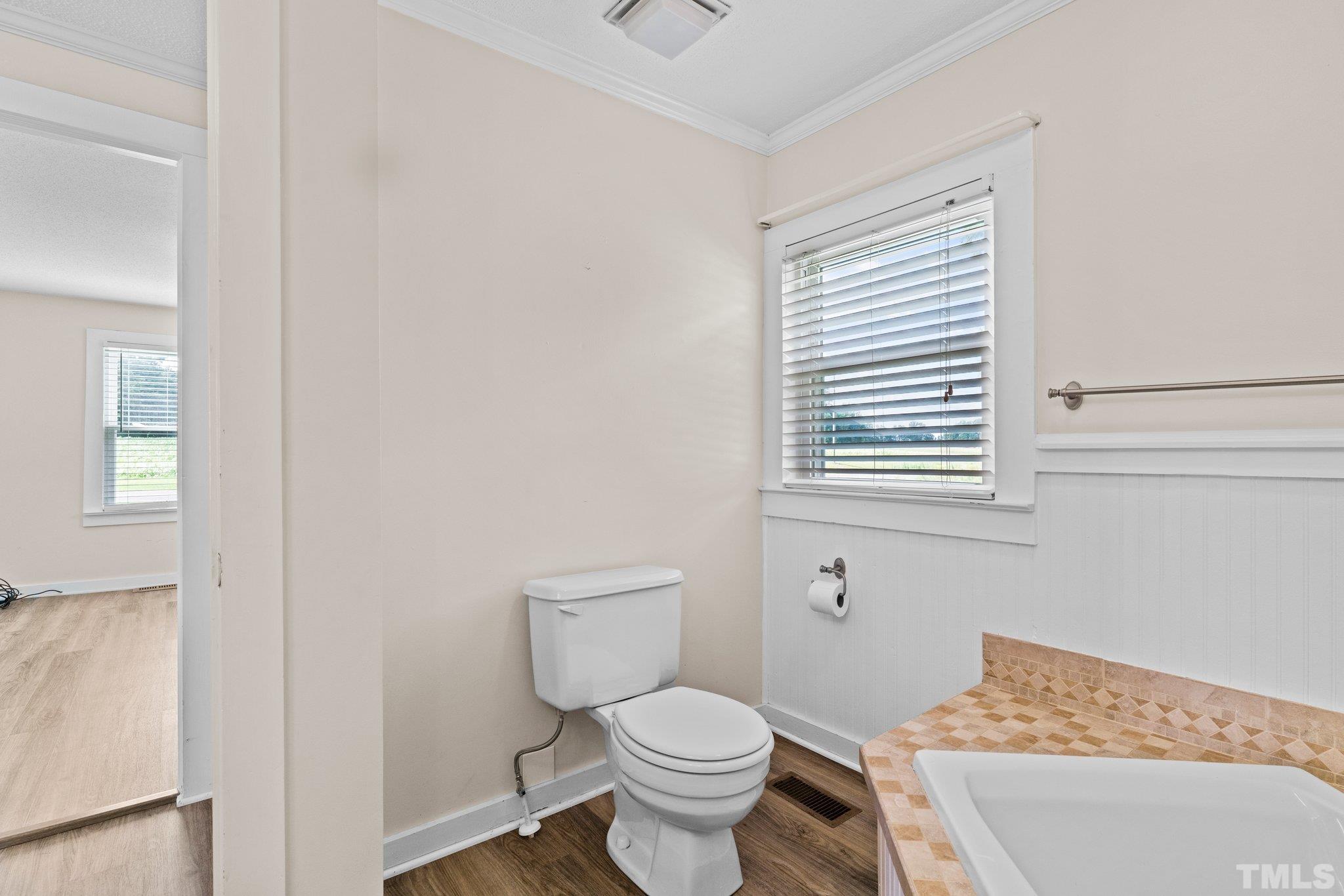 2929 Wall Store Road Garner, NC 27529 - Photo 15 of 59 a bathroom with a toilet and a sink