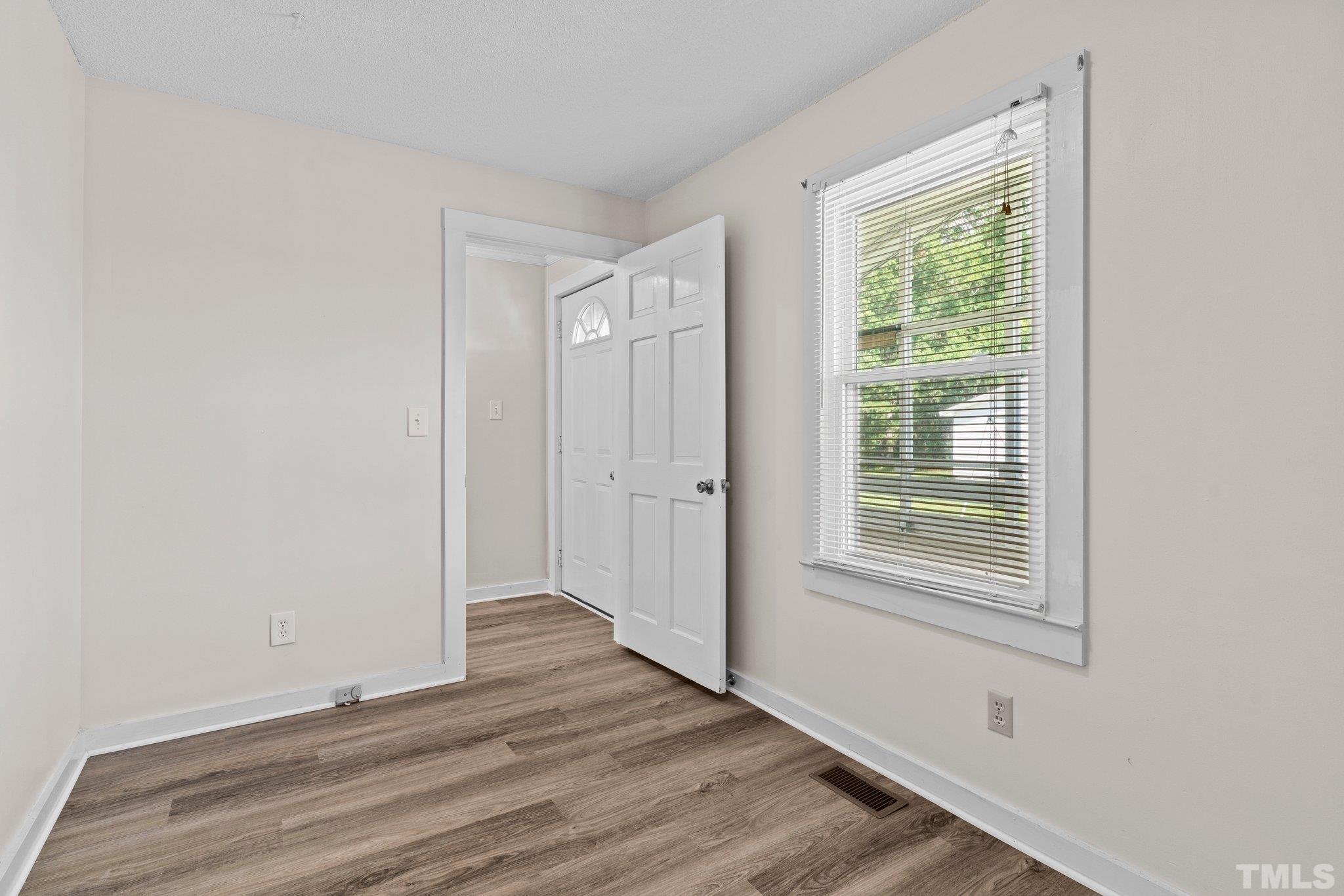 2929 Wall Store Road Garner, NC 27529 - Photo 17 of 59 a view of a room with wooden floor and window