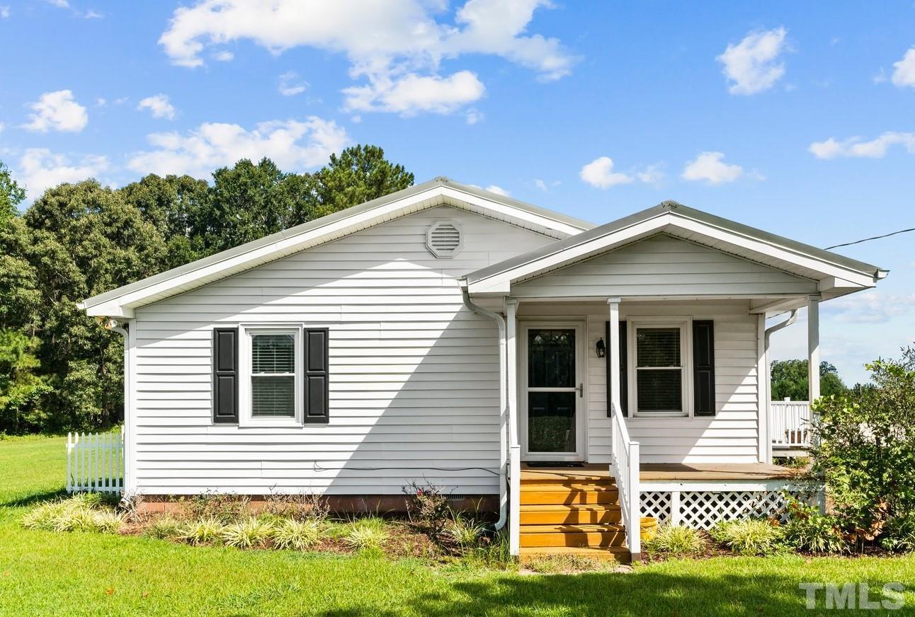 2929 Wall Store Road Garner, NC 27529 - Photo 2 of 59 a front view of a house with a yard