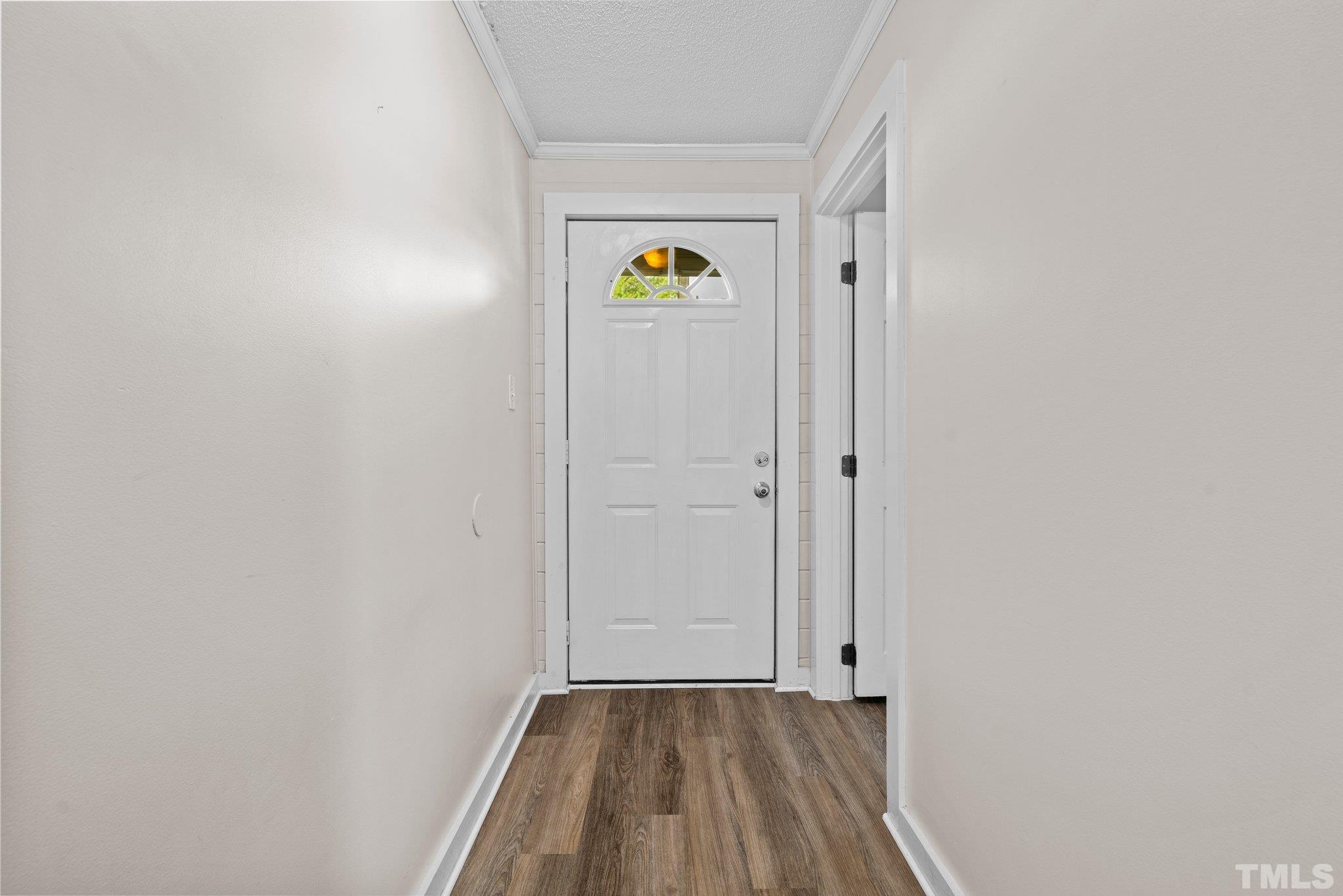 2929 Wall Store Road Garner, NC 27529 - Photo 27 of 59 a view of an entryway with wooden floor