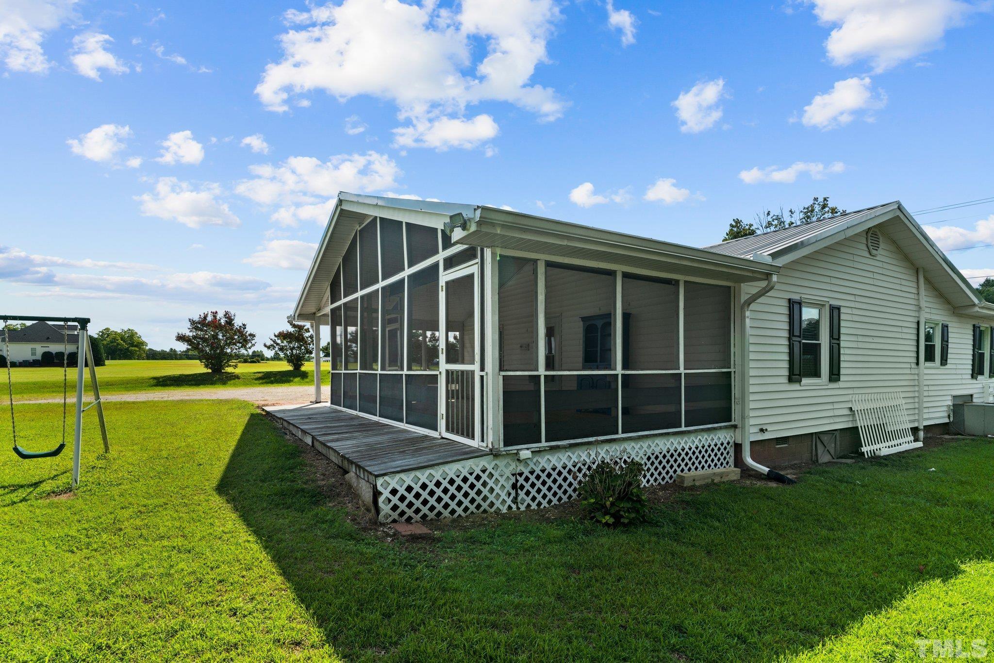 2929 Wall Store Road Garner, NC 27529 - Photo 35 of 59 a view of a house with a yard